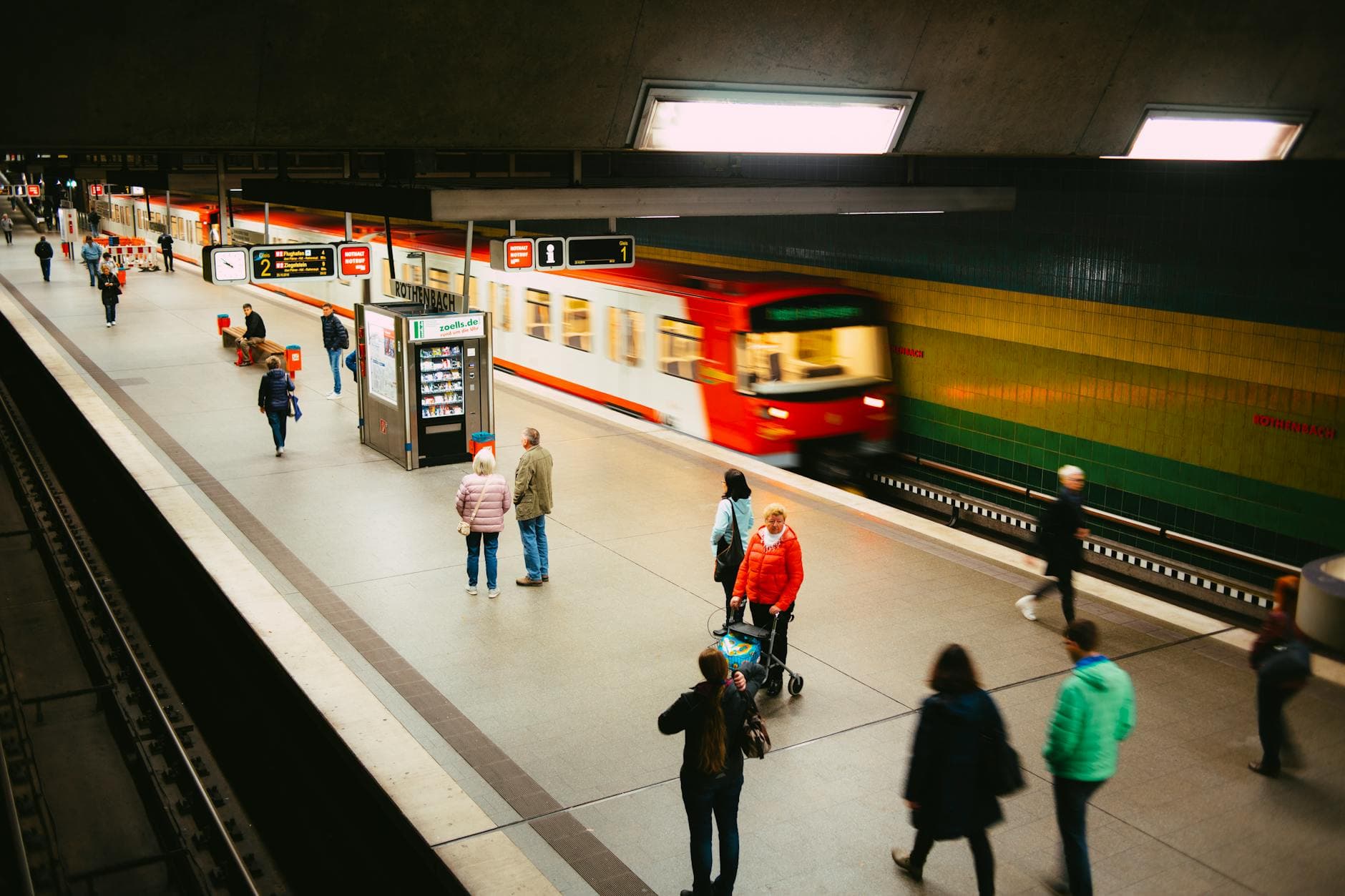 Vibrant subway station scene with people and a fast-moving train on the platform. - intermittent fasting guide