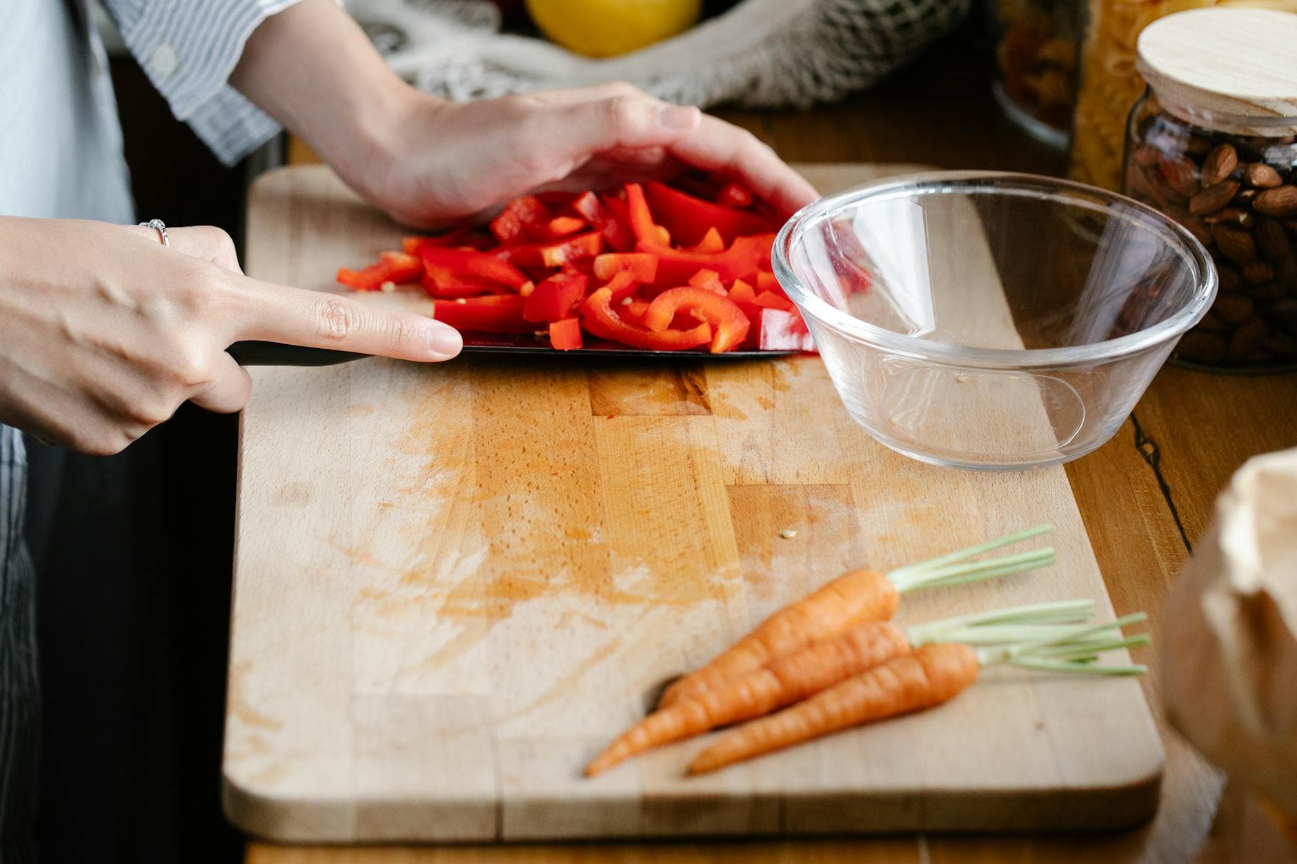 Hands preparing fresh vegetables on a cutting board, capturing the essence of healthy cooking. - meal prep ideas
