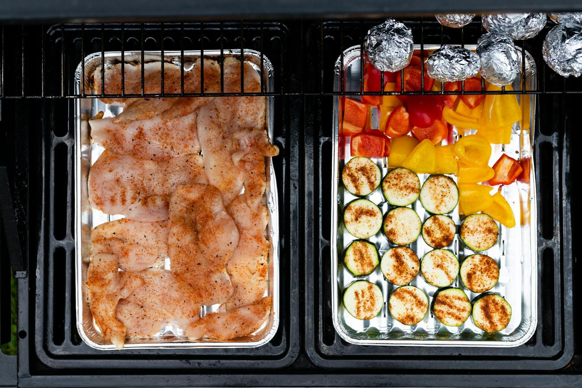 Top view of grilled chicken and vegetables on a barbecue grill, perfect for cooking inspiration. - mediterranean chicken recipe