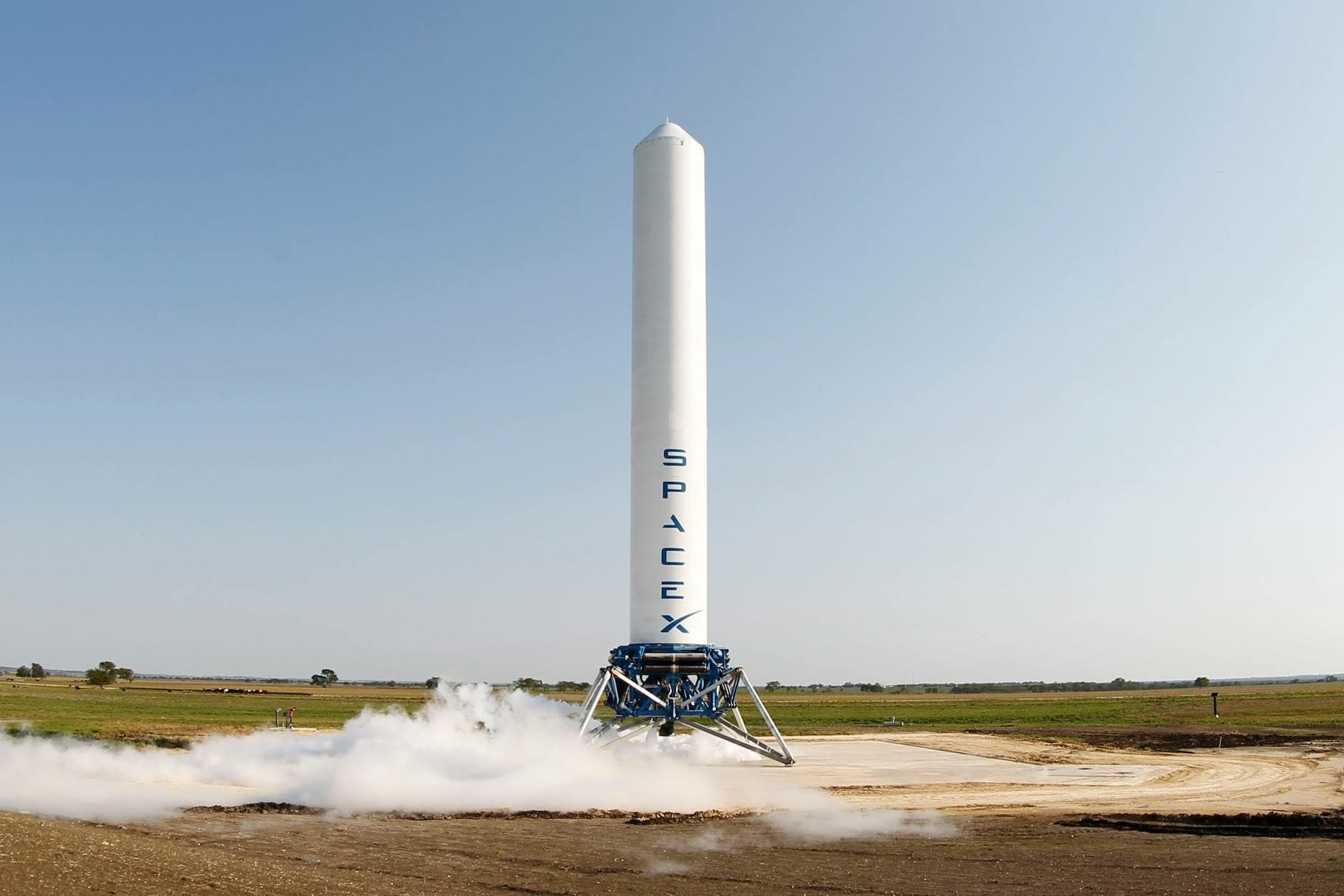 A SpaceX rocket prepares for launch in a rural landscape, capturing a sense of technological advancement. - natural energy boosters