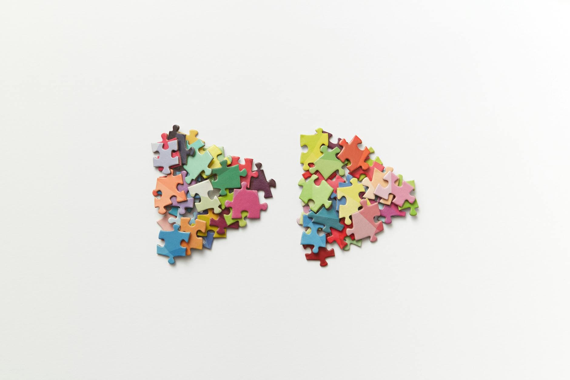 Brightly colored puzzle pieces scattered creatively on a white background. - spring mood disorders