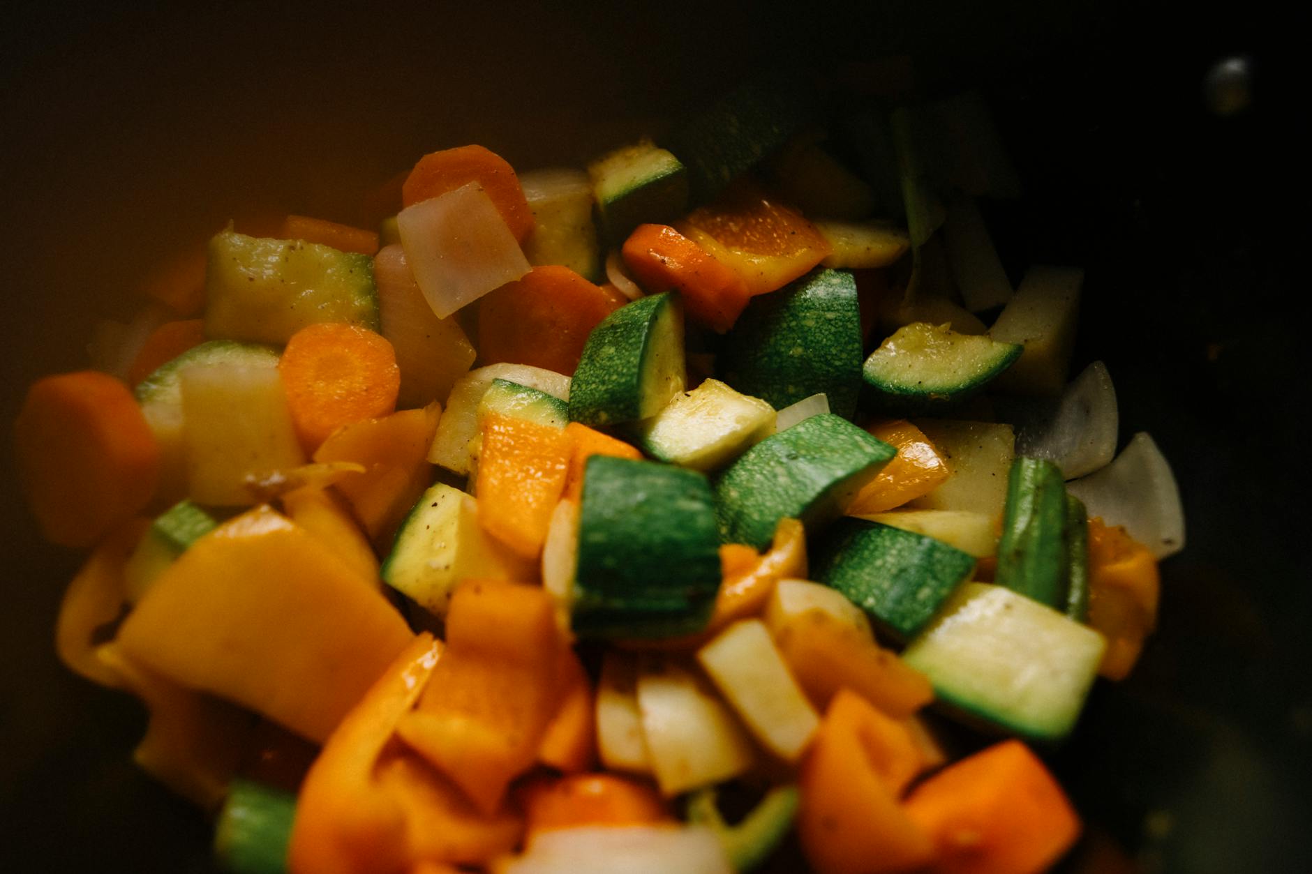 Close-up of sliced vegetables including zucchini, carrots, and peppers for a colorful and healthy dish. - anti inflammatory recipes