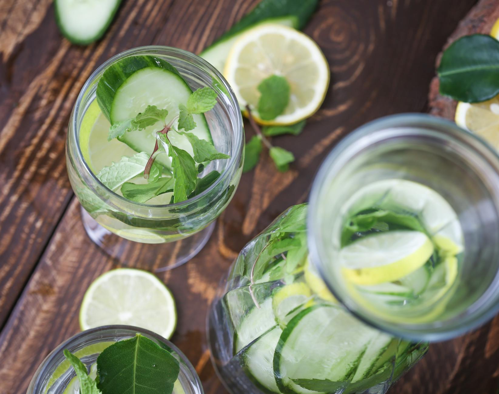 Top view of lemon cucumber water with mint, perfect for detox and hydration. - cucumber lemon detox water