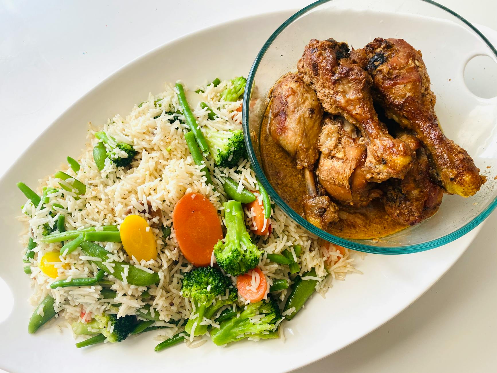 A delectable serving of grilled chicken with rice and mixed vegetables. - free keto recipes