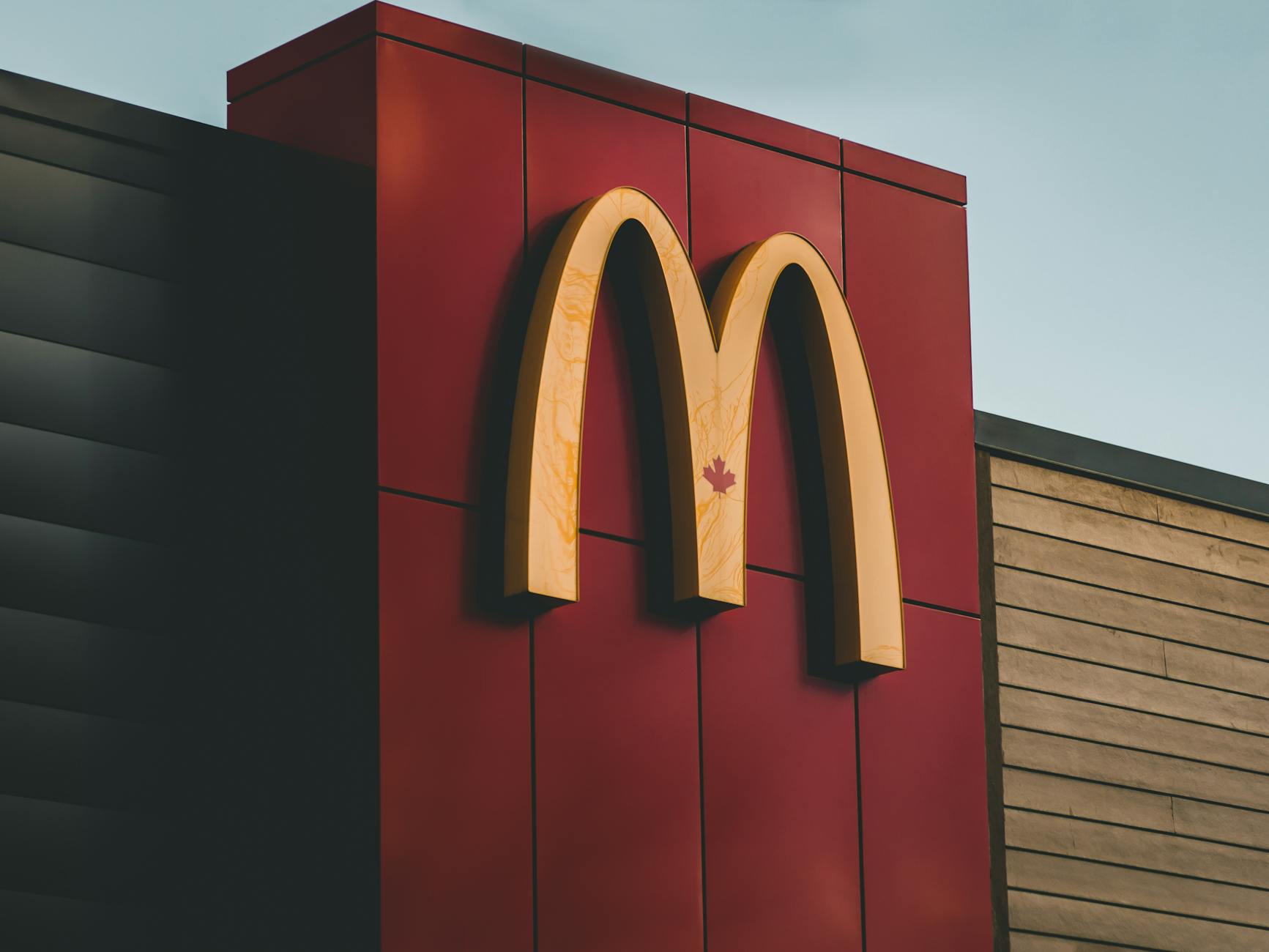 Close-up of McDonald's logo featuring a maple leaf on a building in Surrey, BC, Canada. - healthiest mcdonald's breakfast