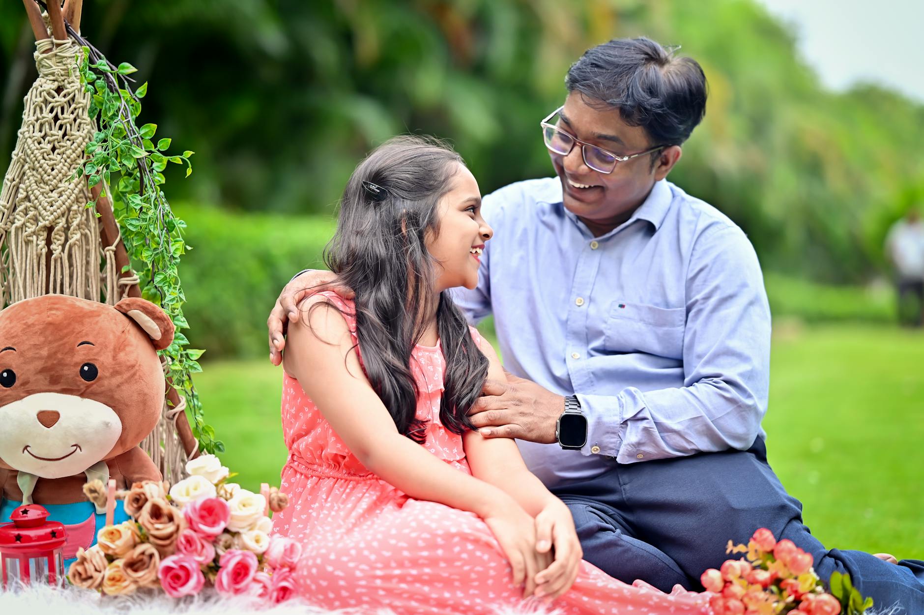 Happy father and daughter bonding during a cheerful outdoor picnic in a garden. - healthy breakfast near me