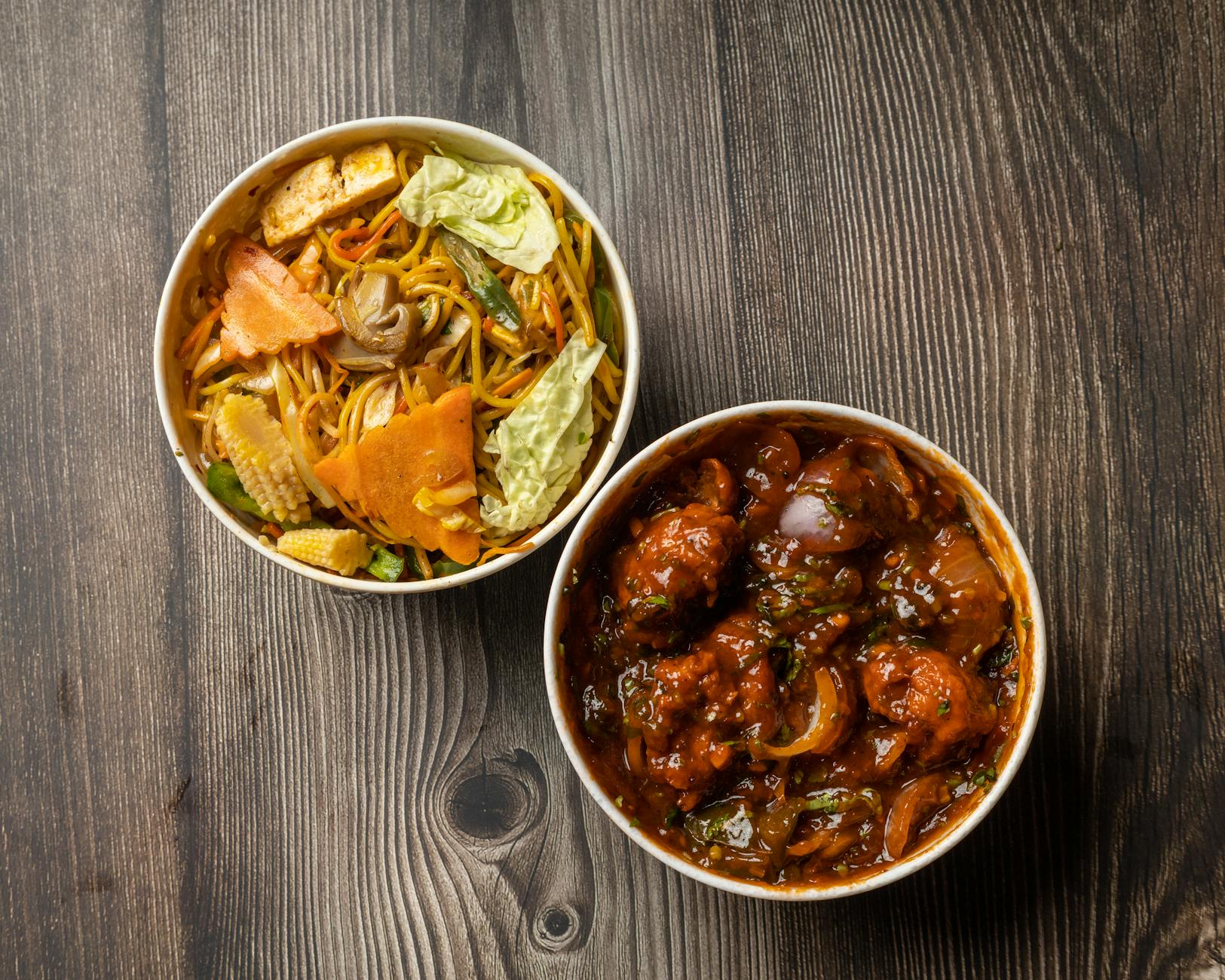 An appetizing two-dish combo featuring Chinese noodles and spicy chilli chicken, perfect for a flavorful meal. - healthy dinners for two