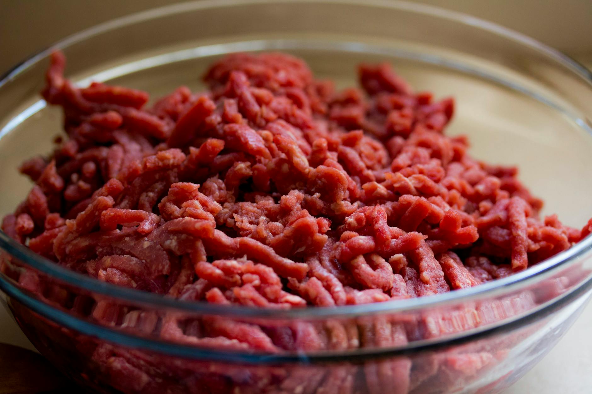 High-quality image of fresh ground beef in a glass bowl, ideal for culinary and food-related themes. - low carb dinner recipes