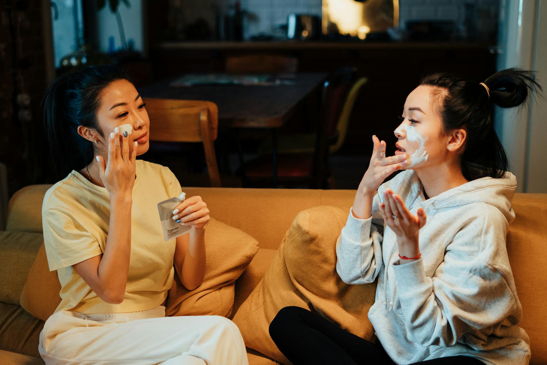 Two friends enjoy a relaxing skincare session at home, enhancing their beauty routines together. - best natural skin care