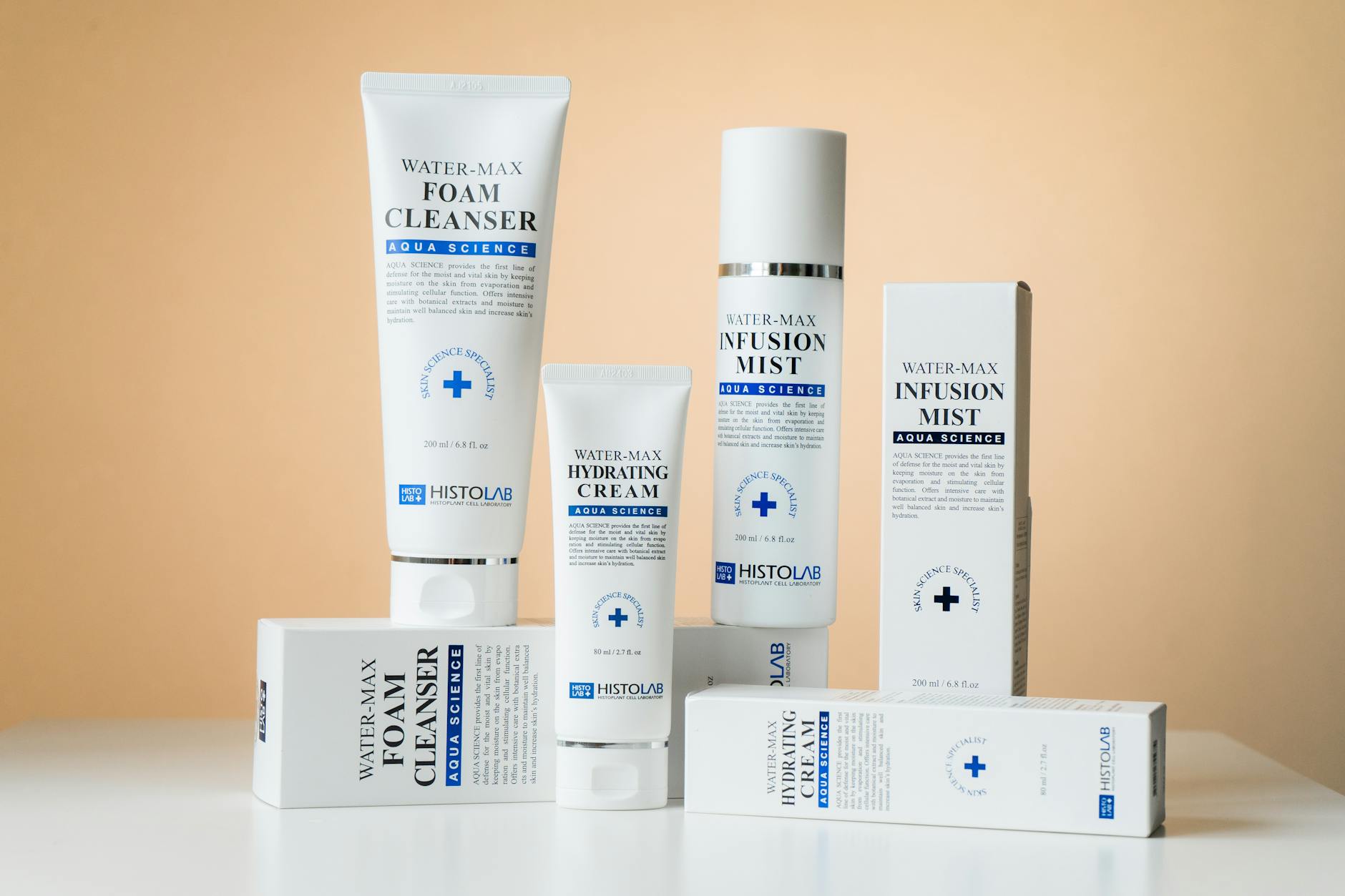 Elegant showcase of Water-Max skincare products including cleanser, cream, and mist on a white surface. - buy natural skin care products