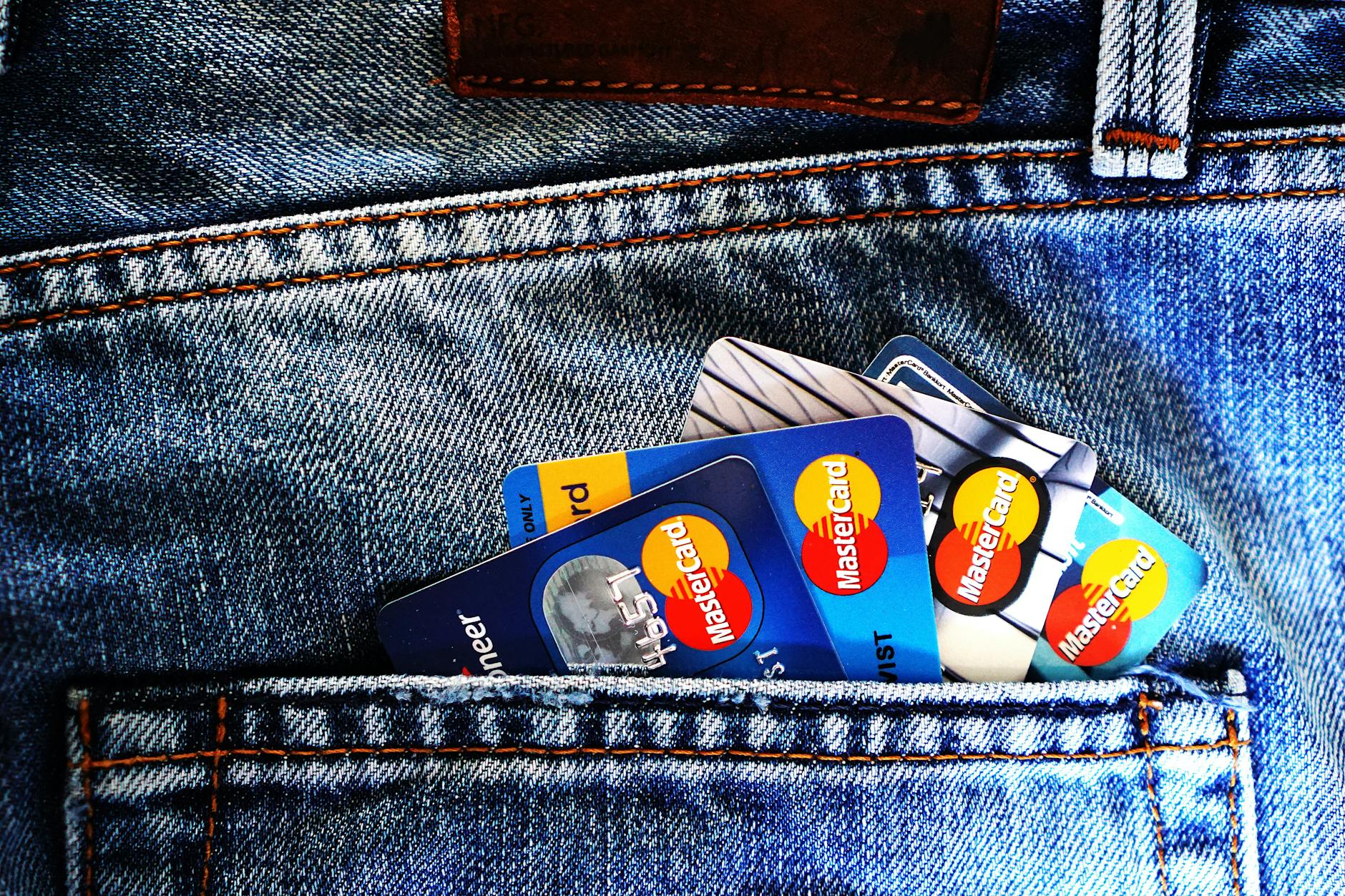 Close-up of a denim pocket with multiple credit cards, illustrating finance and fashion. - detox drink recipes
