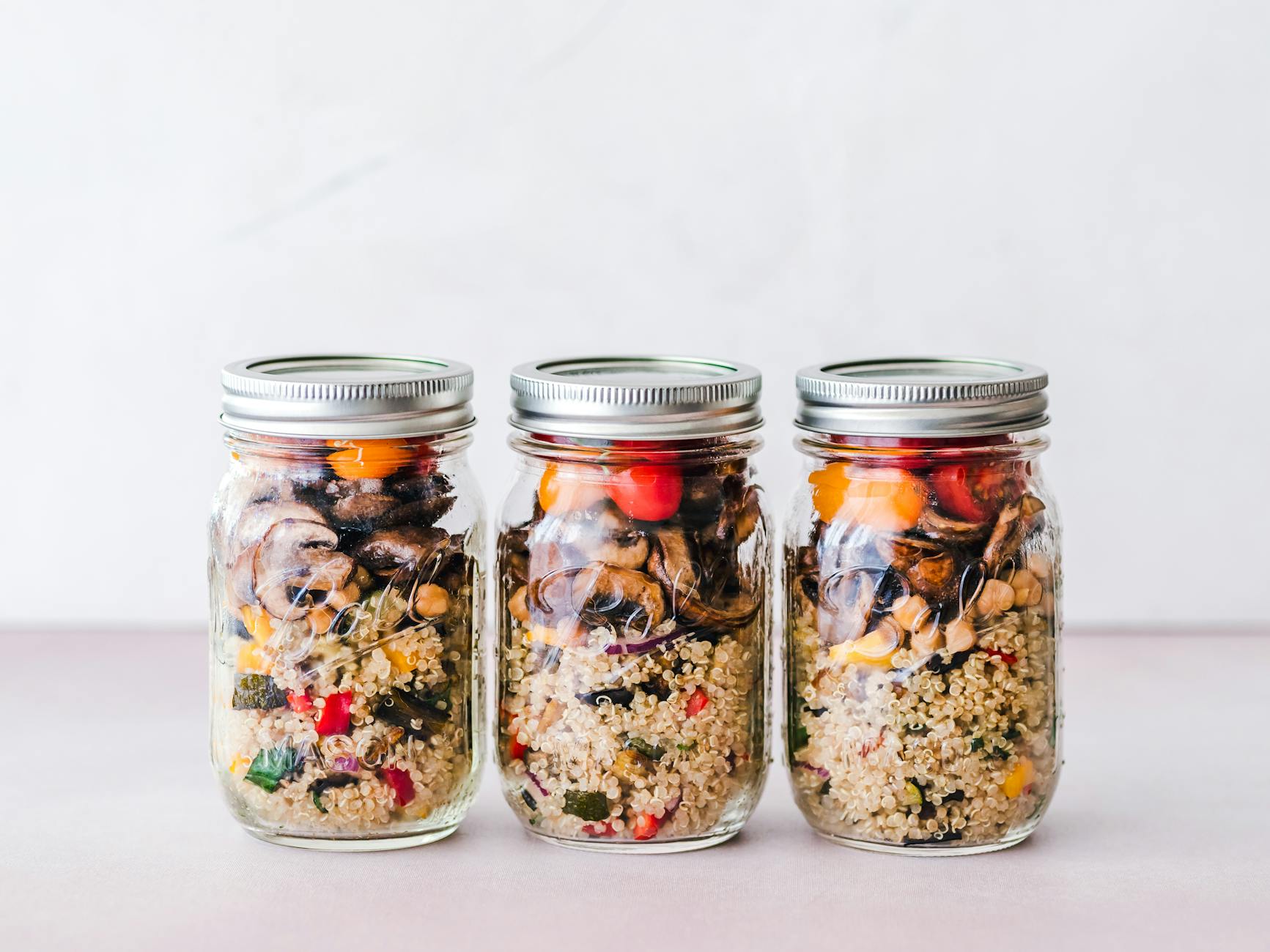 Colorful quinoa salad jar with roasted veggies, ideal for healthy meal prep. - easy healthy meals