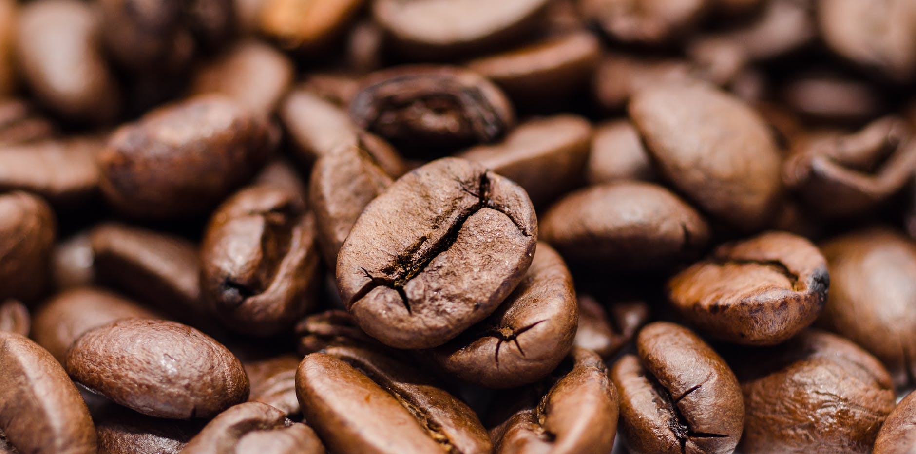 Rich and textured close-up of roasted coffee beans, ideal for coffee lovers. - natural energy boost
