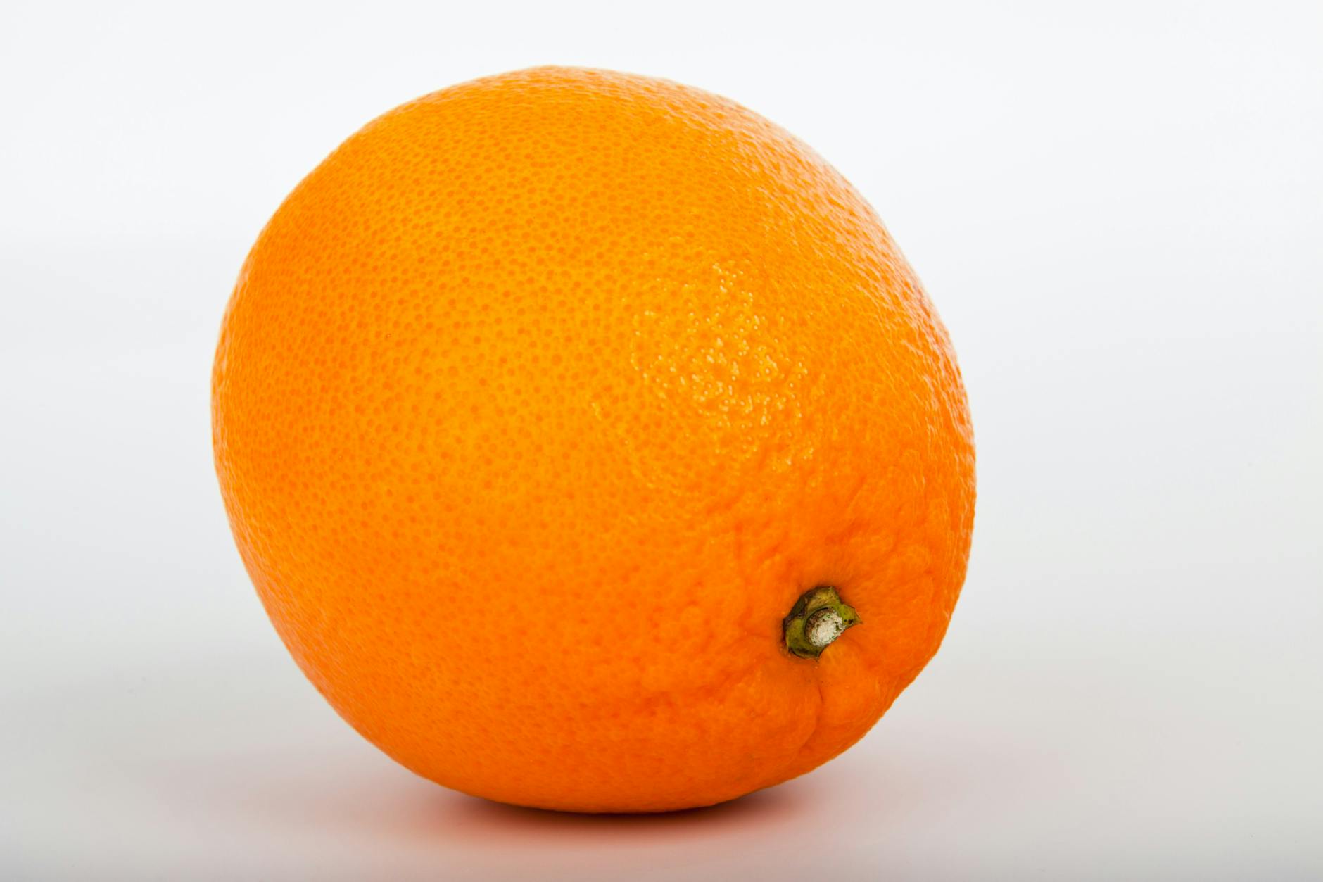 Bright and fresh orange isolated on a white background, perfect for food and health themes. - natural energy boosters