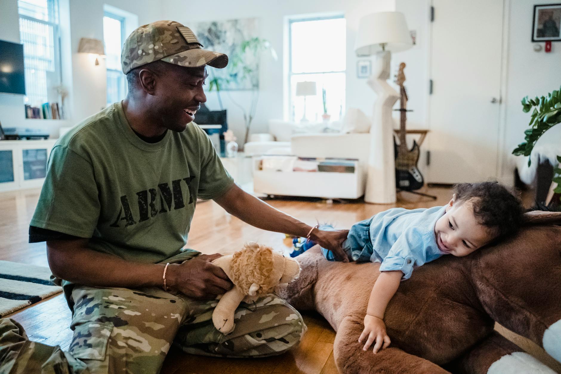 A joyful moment of a father and child playing together at home, enjoying toys. - spring fatigue remedies