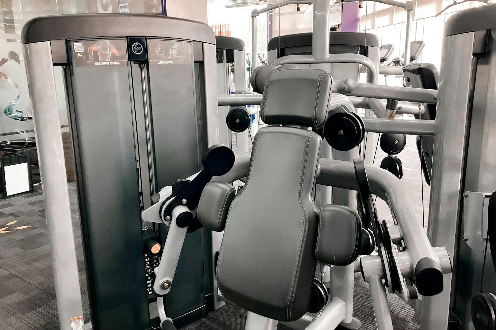 High-quality gym machine for weightlifting and strength training in a modern indoor fitness center. - gym cardio machines