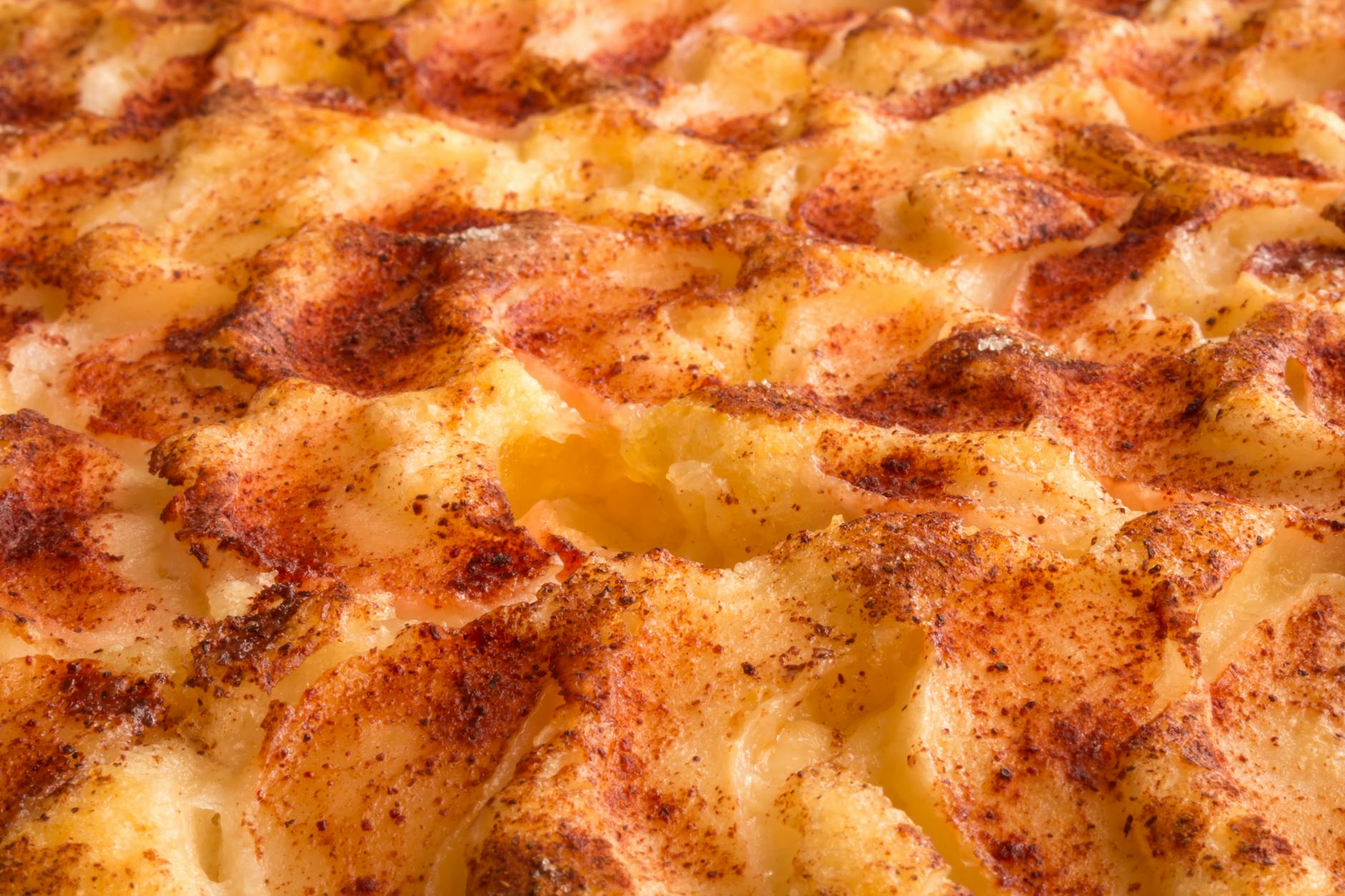 Delicious close-up of grilled mashed potato topping with golden brown crust and spices. - healthy casserole recipes