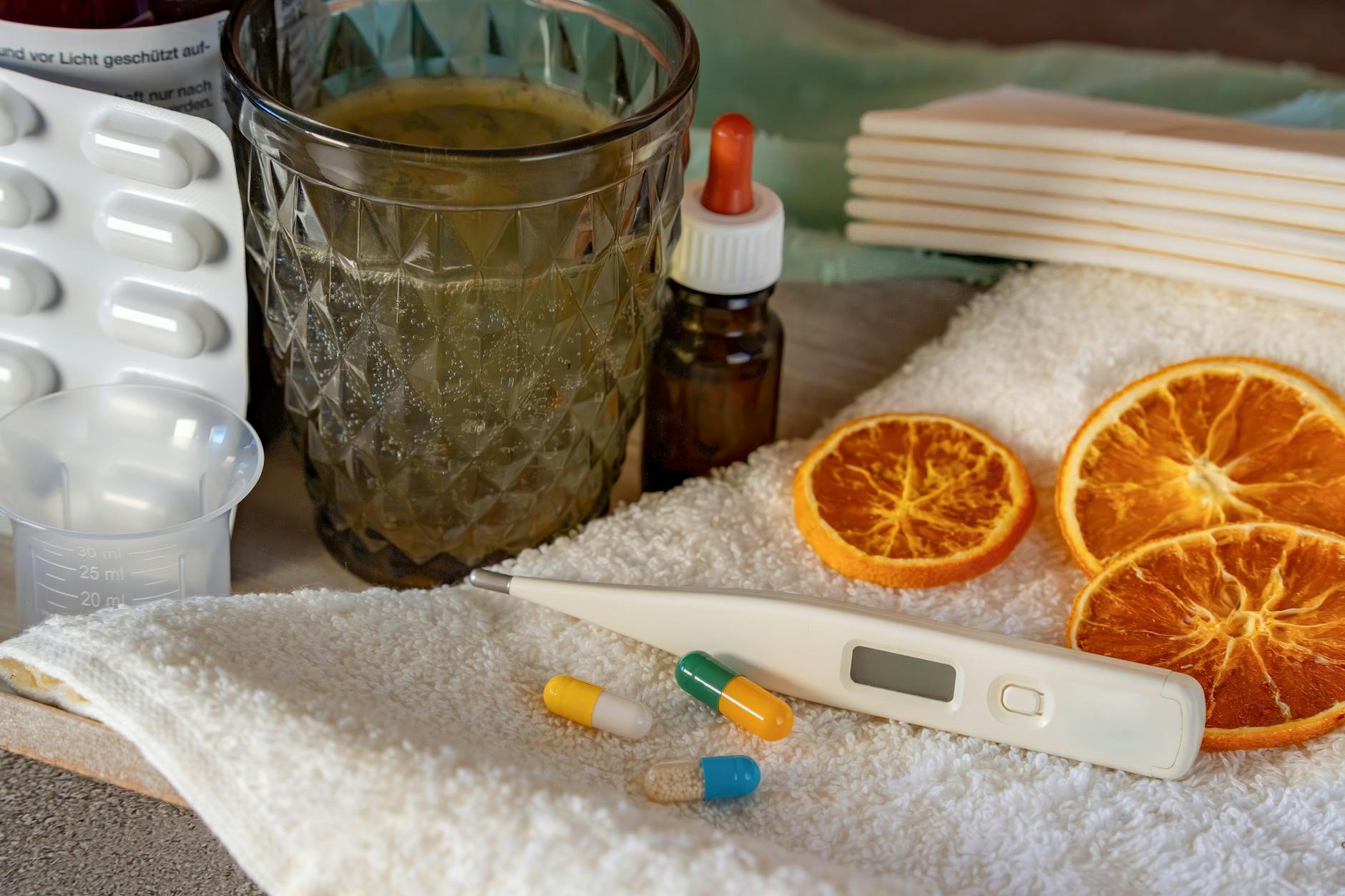 A flat lay of home remedies for cold and flu, featuring herbs and pharmaceuticals. - natural allergy relief