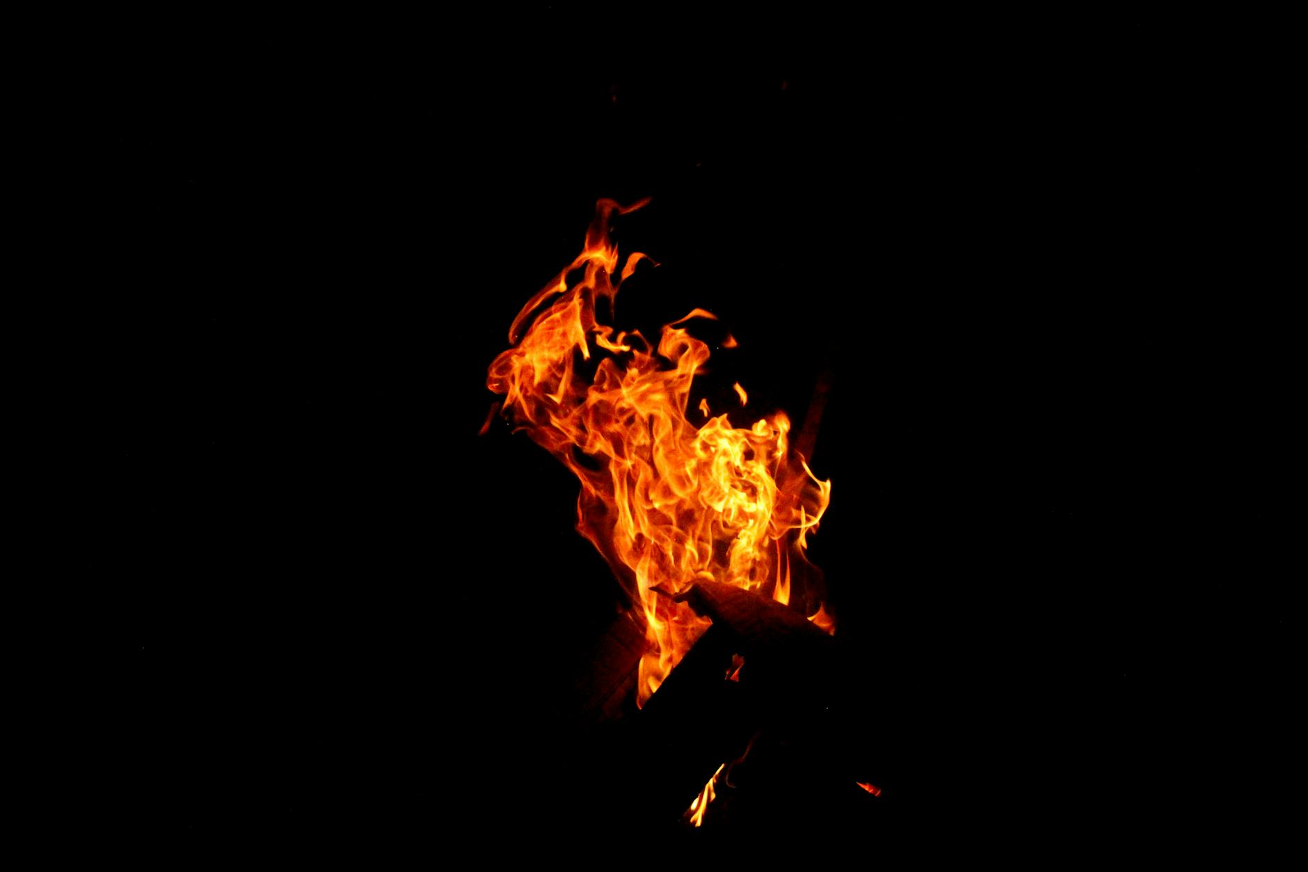 Vivid flames rising against a dark backdrop, capturing the essence of fire's power and beauty. - hiit fat burning