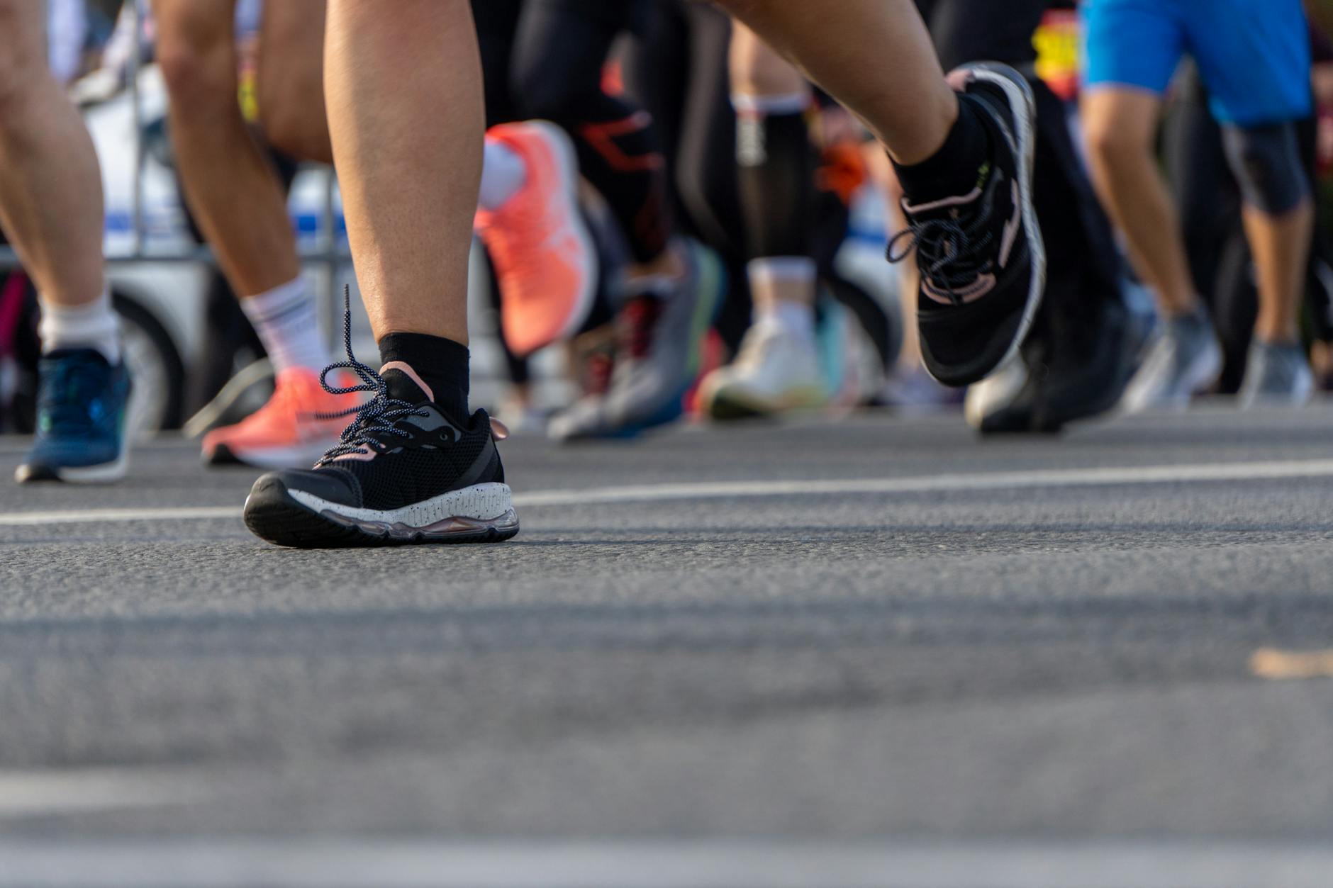 Dynamic shot capturing feet in a marathon, showcasing motion and determination. - spring marathon training